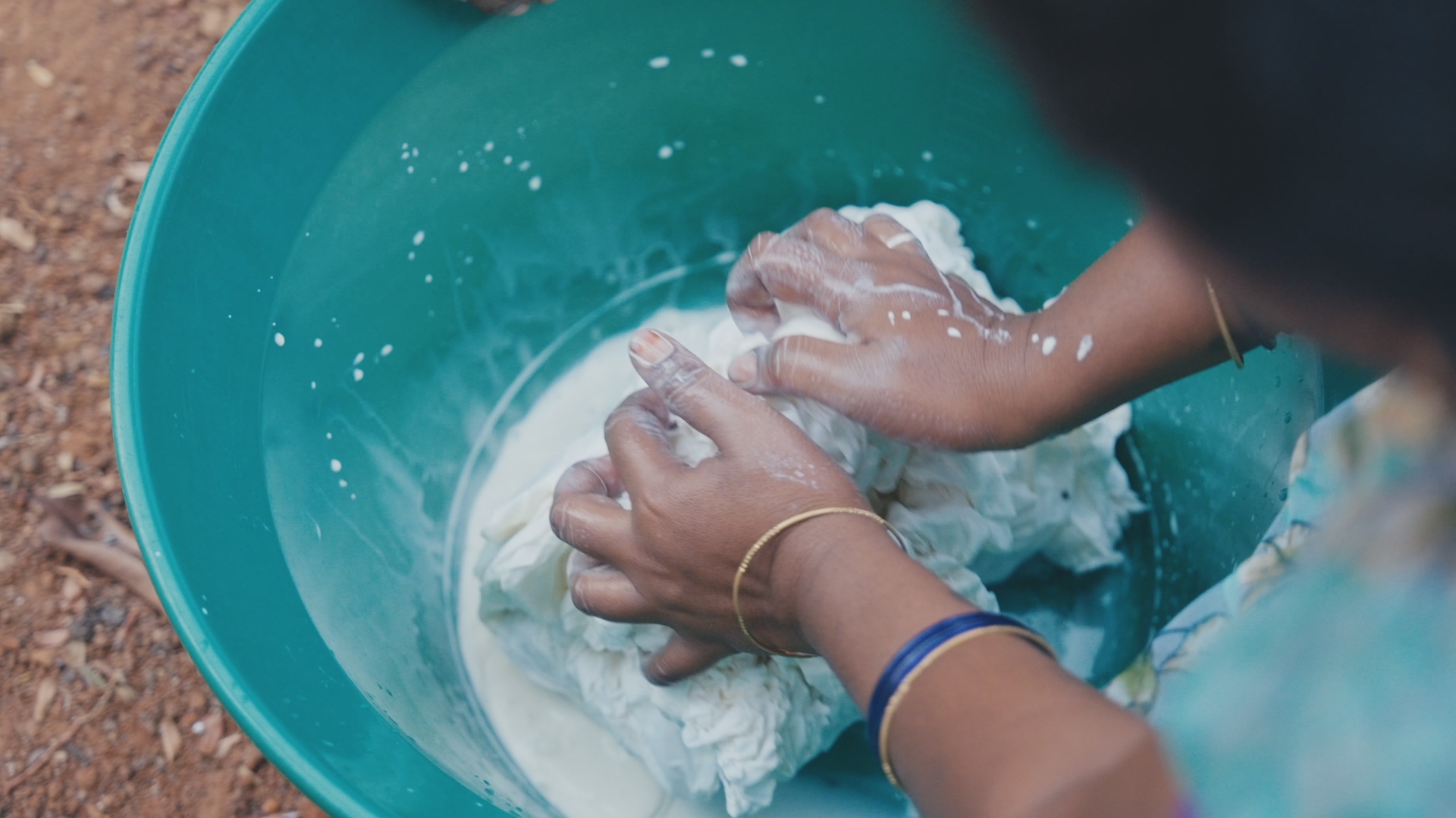 Cloth being washed by hand